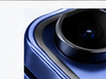 Close view of a round black camera ring on a cobalt-blue phone surface.