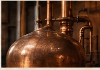 Close-up of a traditional copper distillation vessel; illustrative, not verified Tierra Noble equipment.