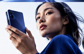 Woman in blue holding a cobalt foldable phone in a softly lit editorial portrait.