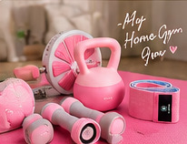 Campaign-art crop showing the pink fitness equipment grouped in a home-gym setting.