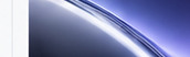 White light grazing a dark blue curved glasslike surface.