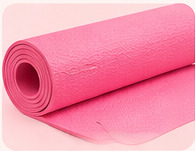 Rolled pink exercise mat shown against a blush background in the supplied poster.