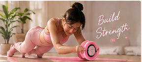 Crop of the supplied campaign artwork showing a woman using a pink ab roller on a mat at home.